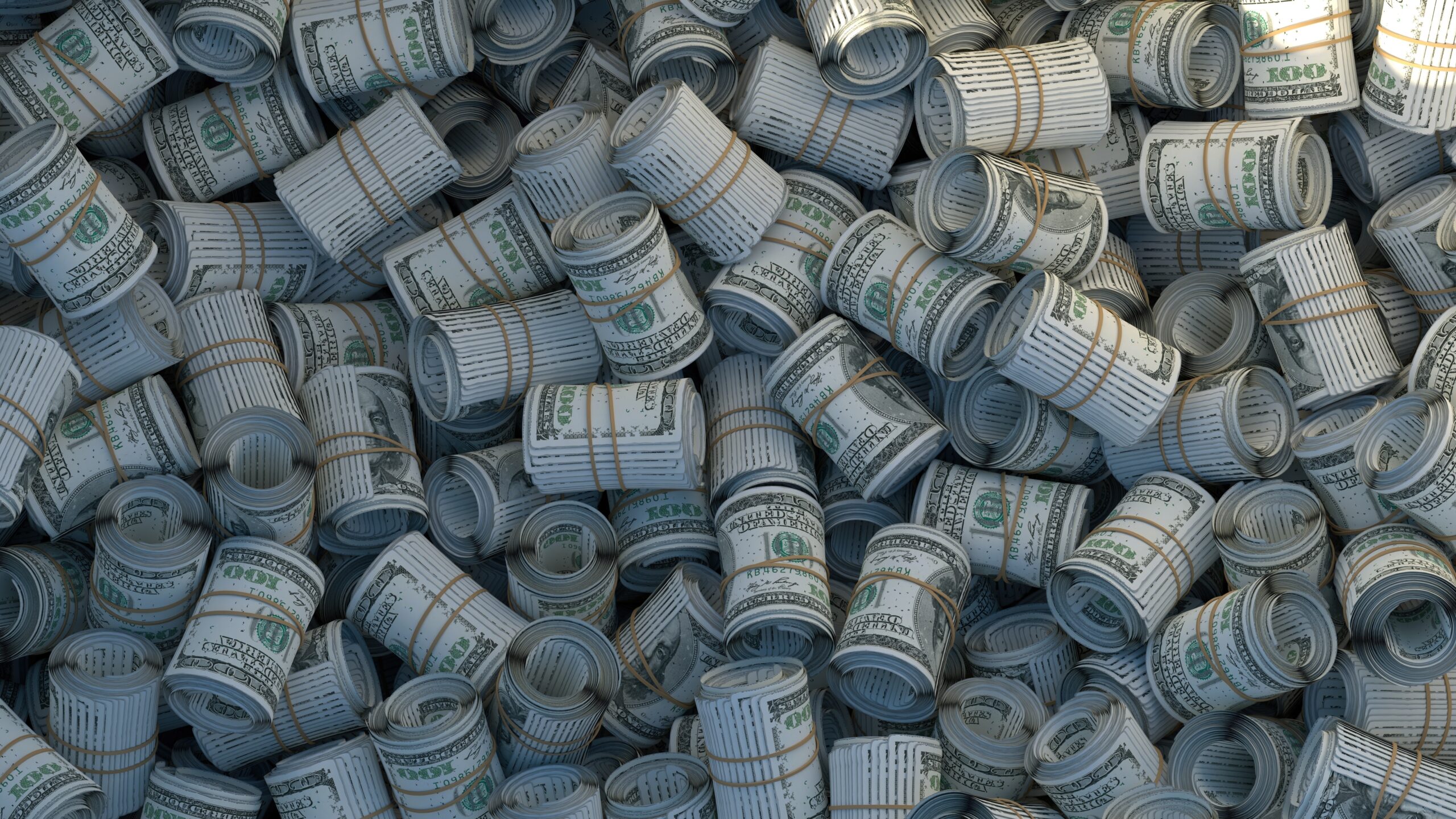 Pile of twenty dollar bills rolled up