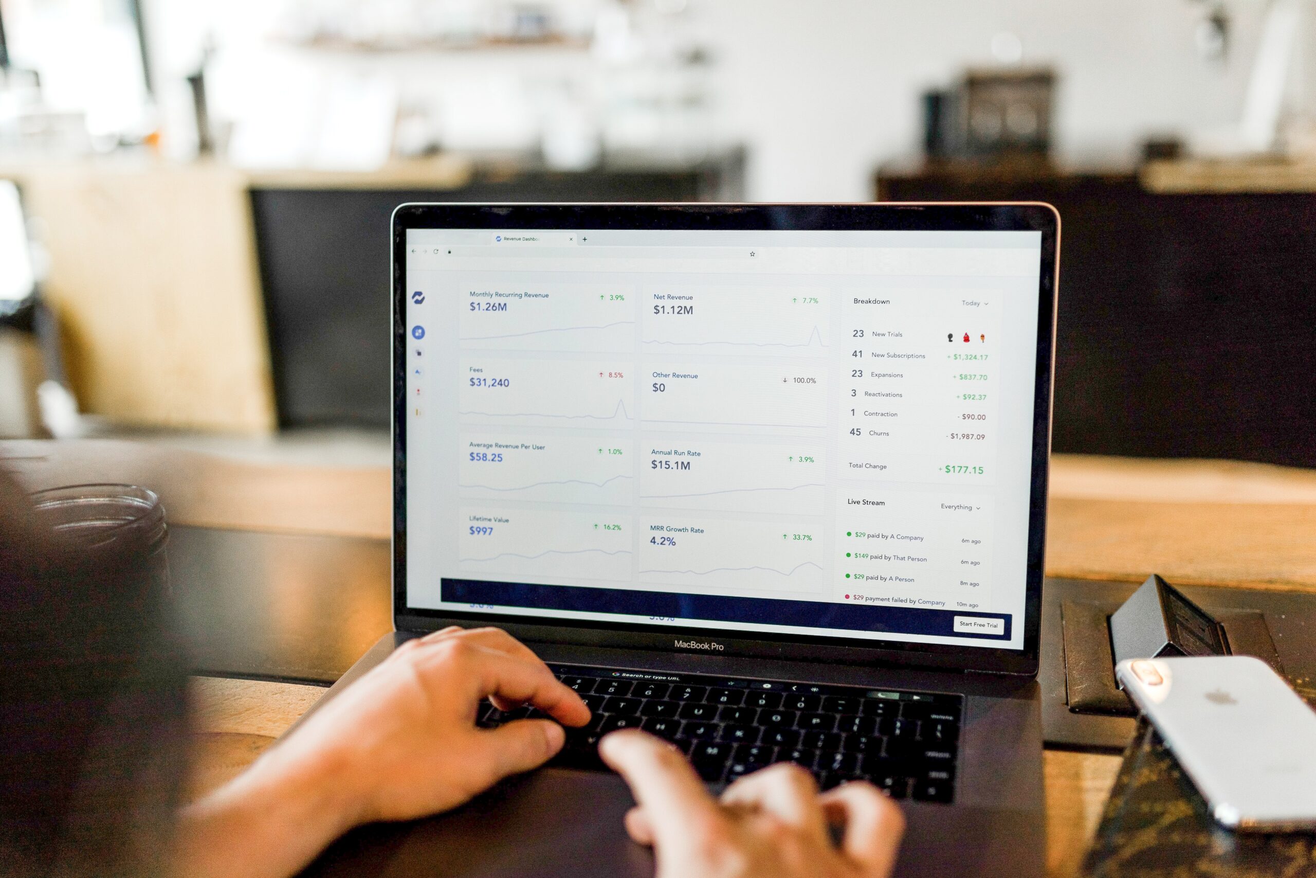 Person using MacBook Pro to invest