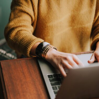 woman typing in computer