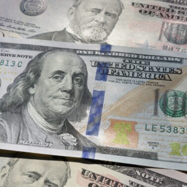 extra money spread out on table