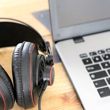 Headphones and laptop sitting on table