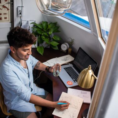 Man sitting at laptop and working from home