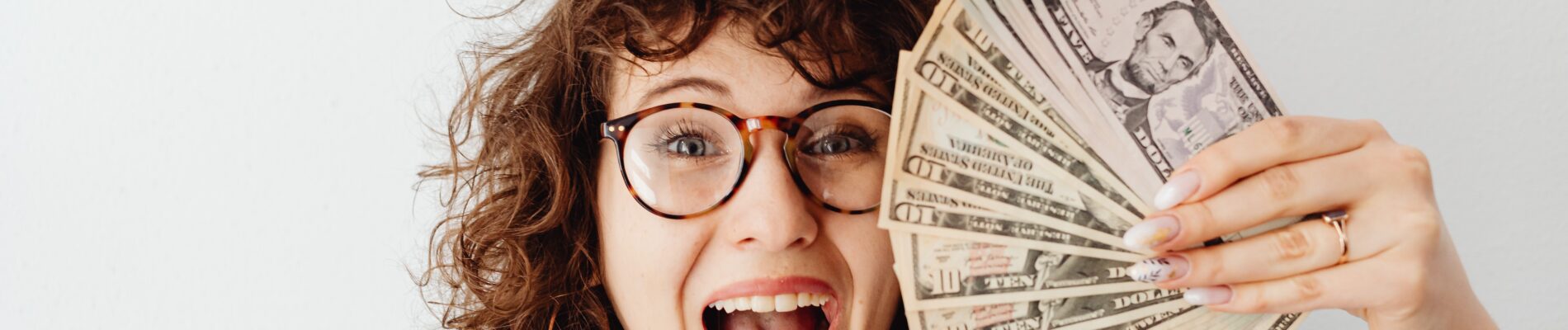 teacher holding extra money