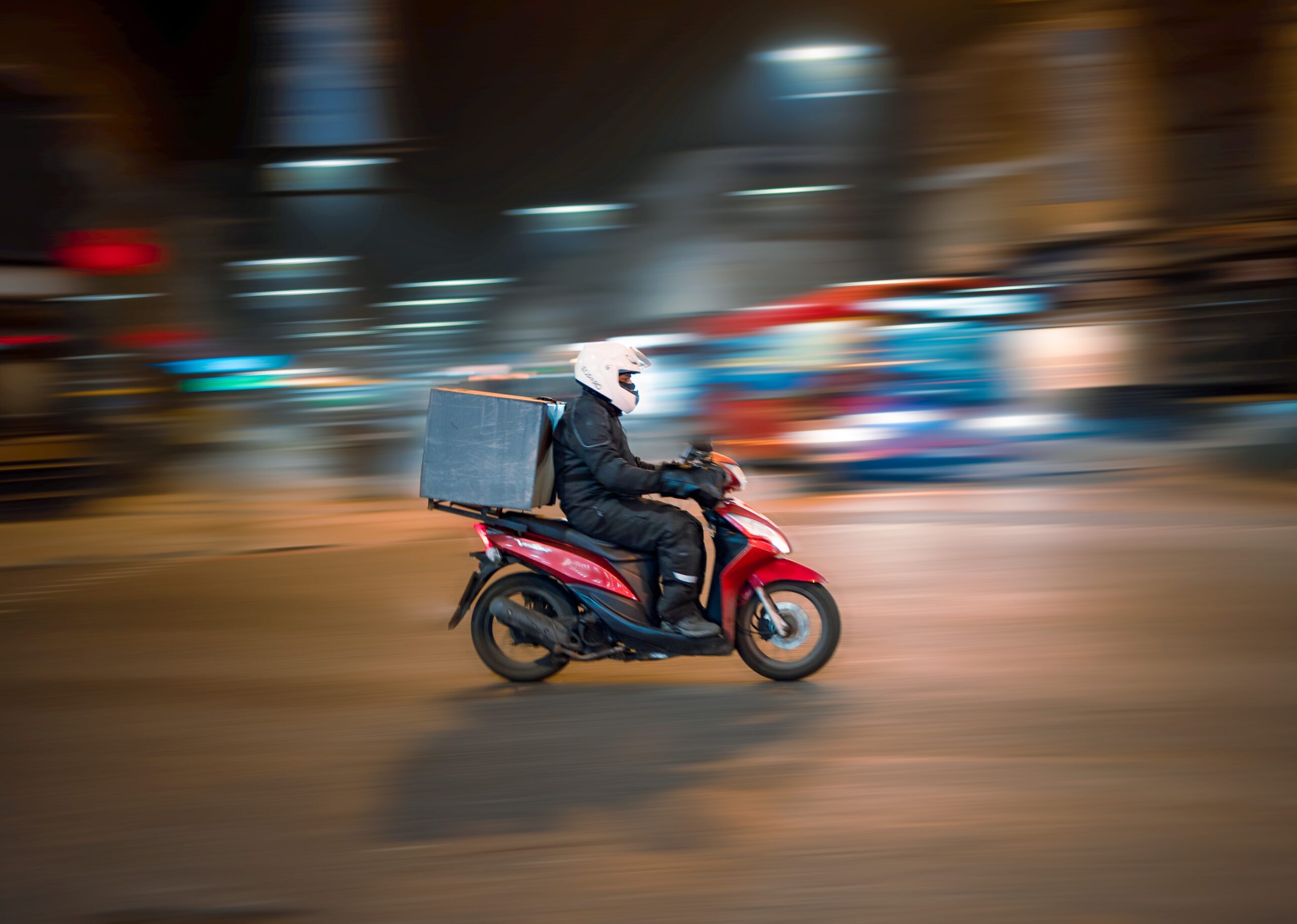 Person delivering for DoorDash on scooter