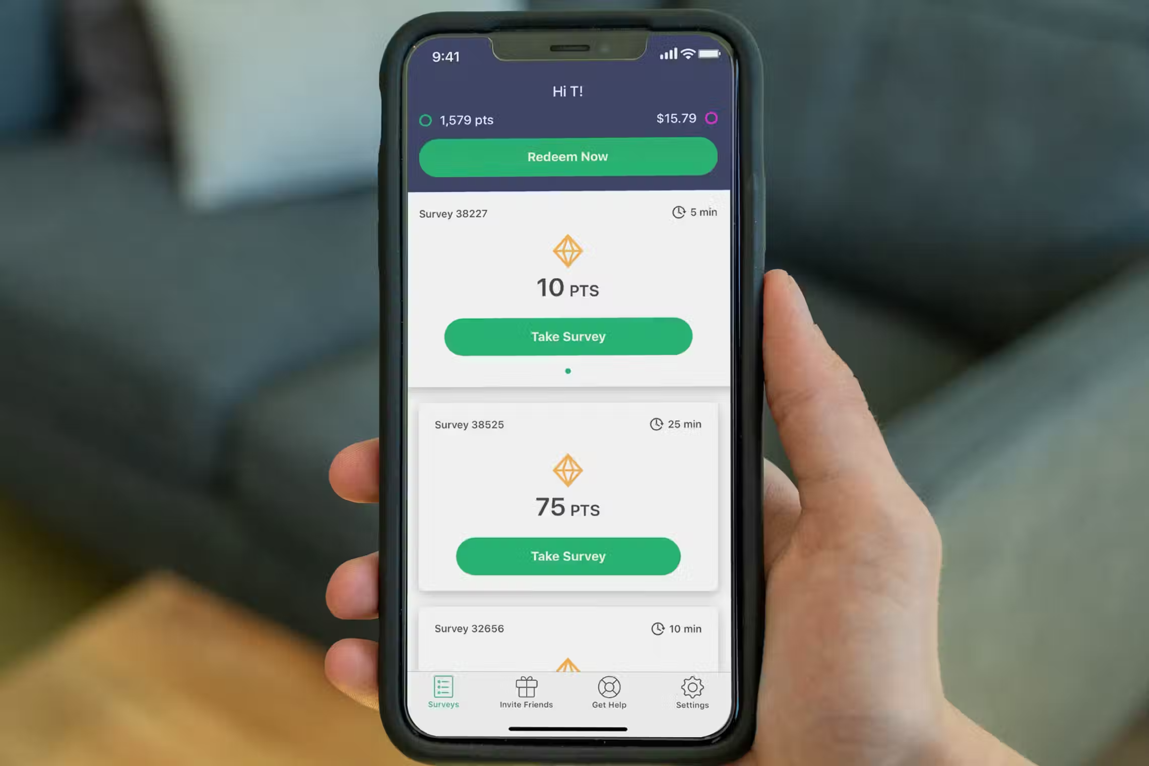 hand holding phone with survey junkie app